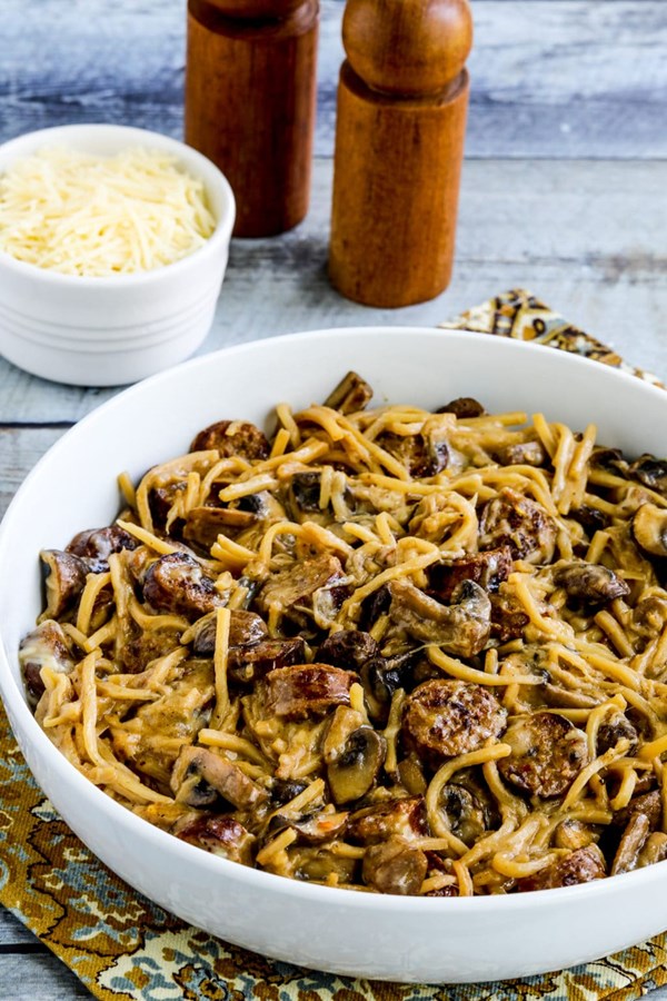 Penne pasta with spicy Italian sausage, mushrooms, and spinach