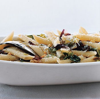 Penne rigate with mixed greens and pine nuts