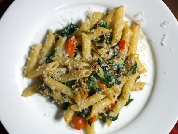 Penne with fried zucchini, sun golds, and arugula