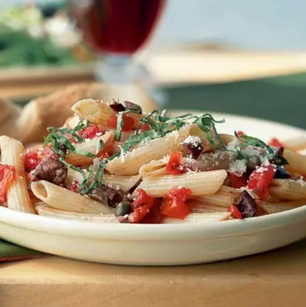 Penne with tomatoes, olives, and capers