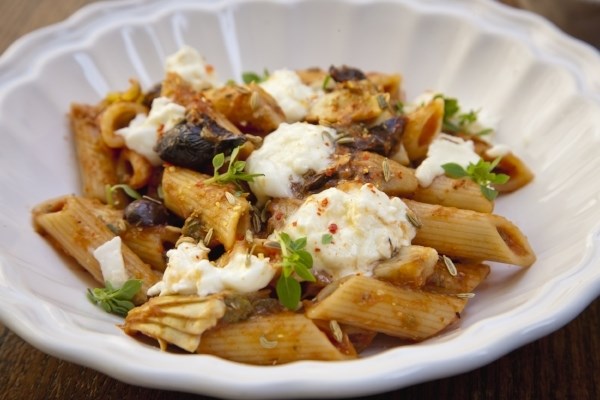 Penne with tomatoes, rosemary, olives, artichokes, and capers