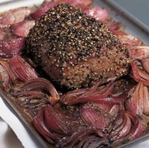 Pepper-crusted fillet of beef with roasted balsamic onions and thyme