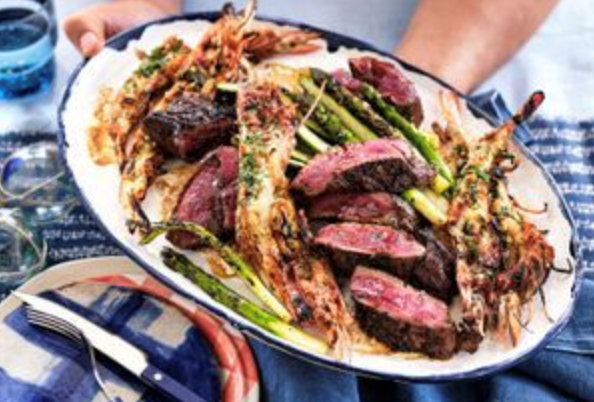 Pepper-seared surf and turf with charred asparagus and sauce Bearnaise