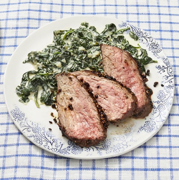 Peppercorn-crusted steak with creamed spinach