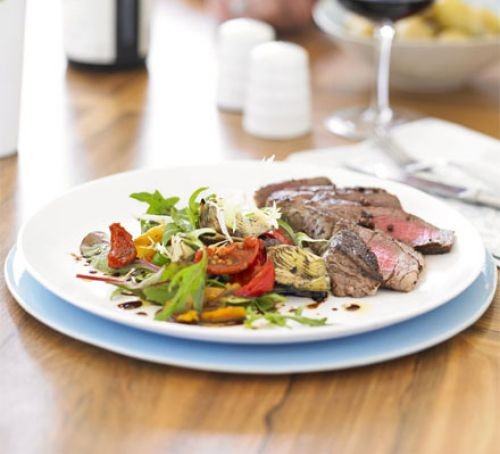 Peppered fillet of beef with grilled artichoke salad