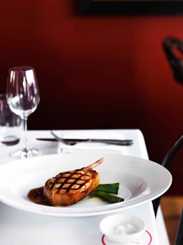 Peppered pork cutlets with Calvados apple purée and grilled leeks