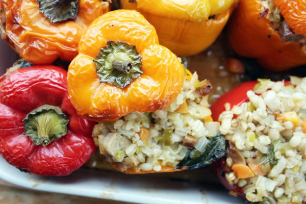 Peppers stuffed with spicy sausage, pearl barley and wild garlic