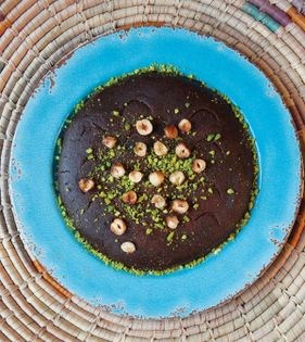 Persian gulf date molasses halva with hazelnuts (Aseda)