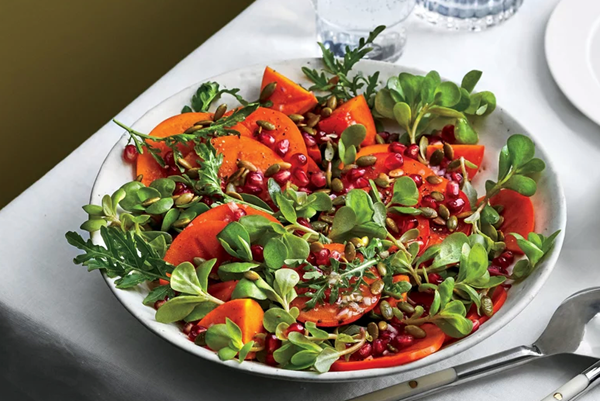 Persimmons, pomegranate, and purslane with pepitas