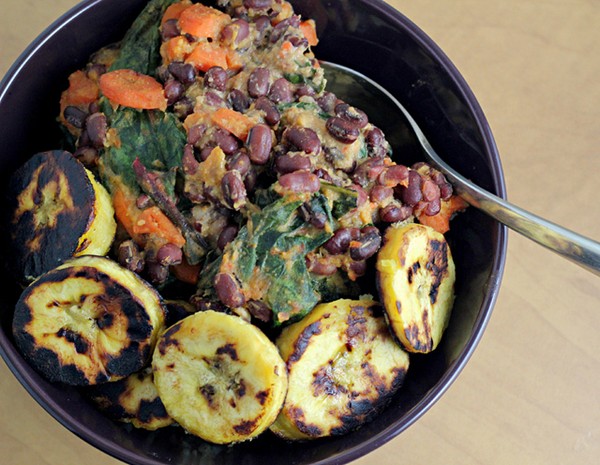 Peruvian bean bowl with a red pepper sauce and fried plantains