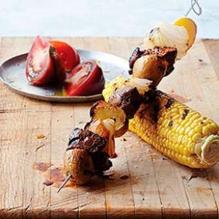 Peruvian beef kebabs with grilled corn