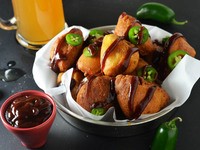 Peruvian fried seafood platter with lime-marinated onion and tomato salad (jalea)