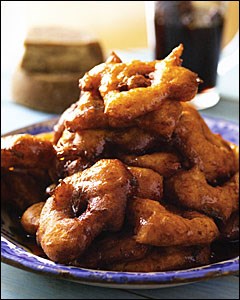 Peruvian sweet potato and pumpkin fritters with spiced syrup (Picarones con miel de especias)
