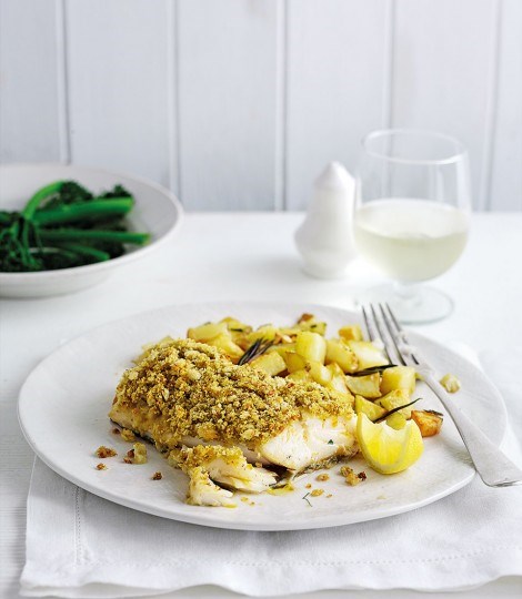 Pesto-crusted cod with garlic roast potatoes