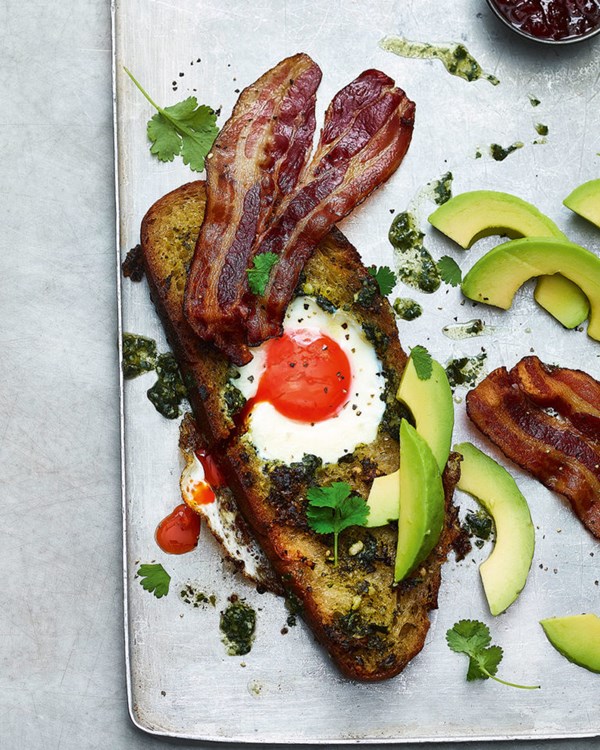 Pesto egg-in-the-hole with avocado and crispy bacon