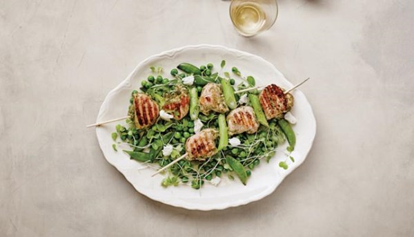Pesto-grilled chicken kebabs with ricotta pea salad