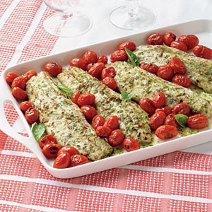 Pesto-marinated striped bass with warm tomatoes