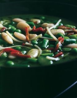 Pesto minestrone with asparagus, broad beans and tomatoes