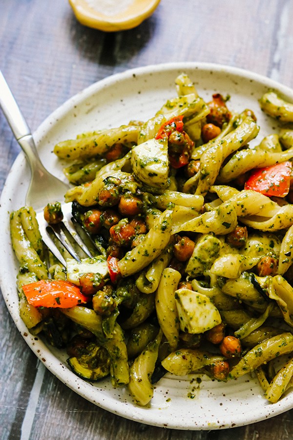 Pesto pasta salad with mozzarella, roasted vegetables, and crispy roasted chickpeas