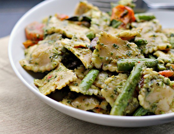 Pesto pasta salad with roasted asparagus, string beans, cherry tomatoes, and olives