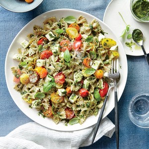 Pesto pasta salad with tomatoes and mozzarella