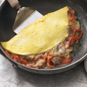 Philly cheesesteak omelet with onions and bell peppers