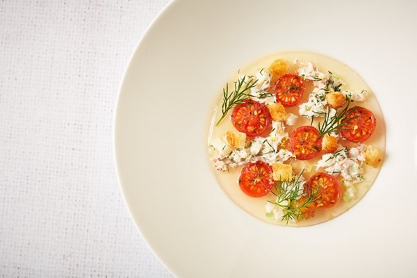  Piccolo tomato consommé with crab, marinated tomatoes and brioche croutons