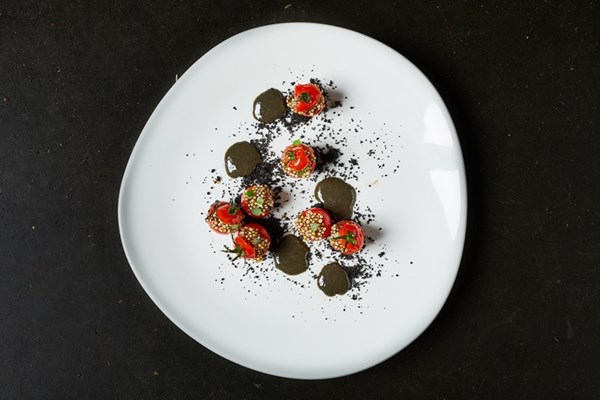 Piccolo tomatoes stuffed with tapioca and black garlic