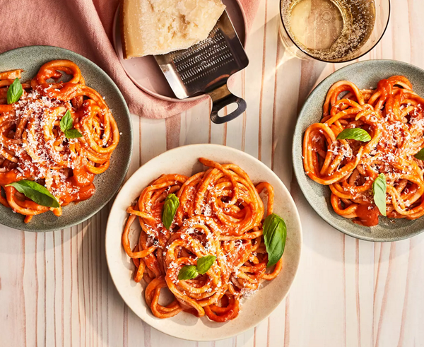 Pici with roasted garlic and tomatoes