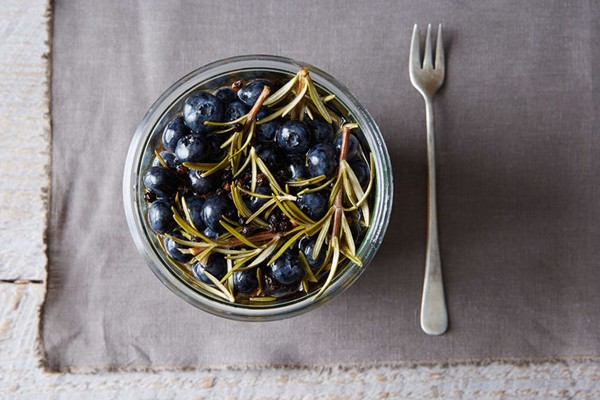 Pickled blueberries with rosemary sprigs