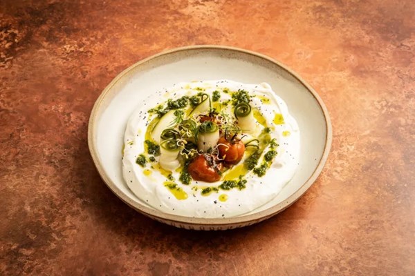 Pickled cucumber with whipped goat's cheese, confit tomatoes and basil