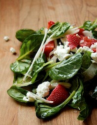 Pickled strawberries with tender greens and goat cheese