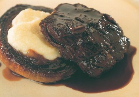 Pieces of braised beef with slowly caramelized onions and turnip purée