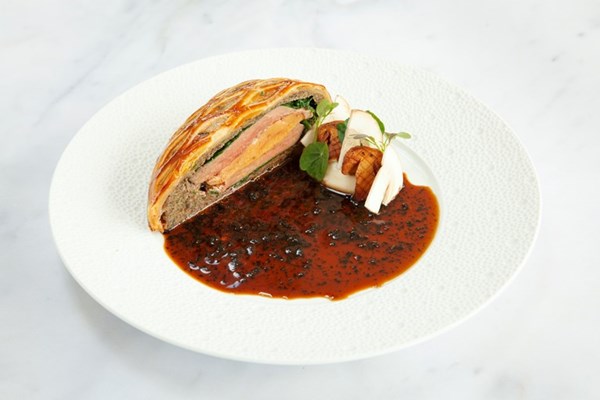 Pigeon and foie gras Wellington with ceps and black truffle sauce