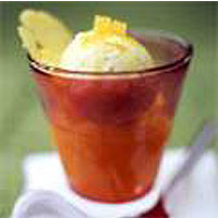 Pineapple ice cream with hot pineapple rum sauce