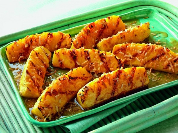 Pineapple wedges with rum butter and toasted coconut