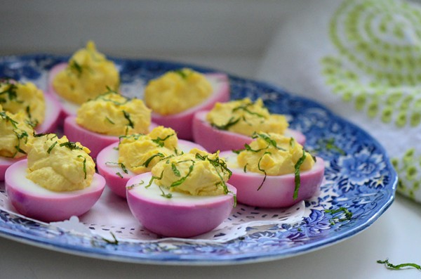 Pink deviled eggs with yogurt and mint