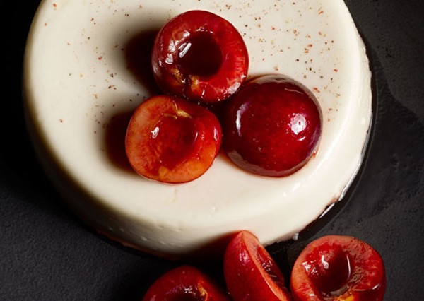 Pink peppercorn panna cotta with macerated cherries