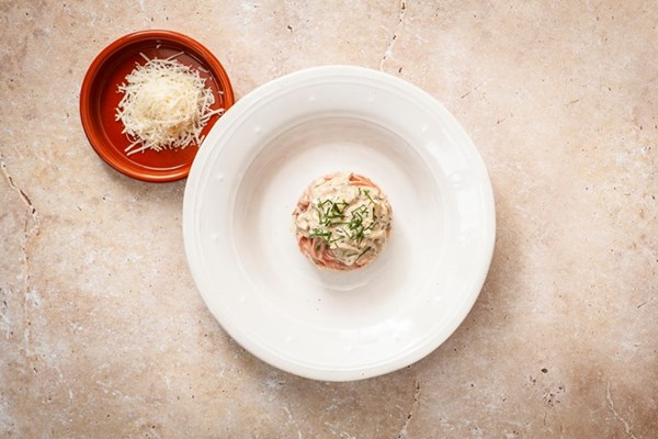 Pink spaghetti chitarra with wild mushrooms