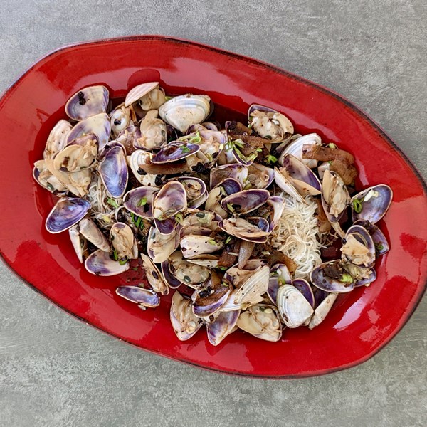 Pipis with black bean & chilli on crisp noodles