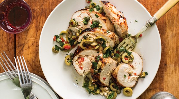 Piquillo pepper–stuffed chicken breasts with green olive tapenade