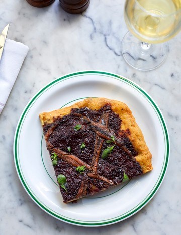 Pissaladière flatbread with caramelised onions, anchovies and black olives
