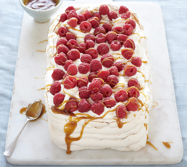 Pistachio and raspberry Pavlova with butterscotch sauce