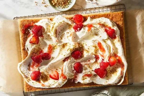 Pistachio celebration cake with whipped custard cream 