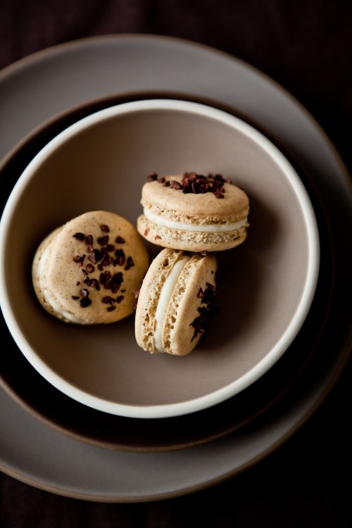 Pistachio cocoa nib macaron with bourbon buttercream