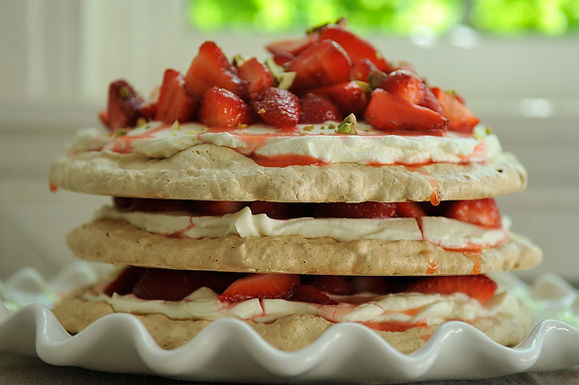 Pistachio meringue stack with rose cream and strawberries
