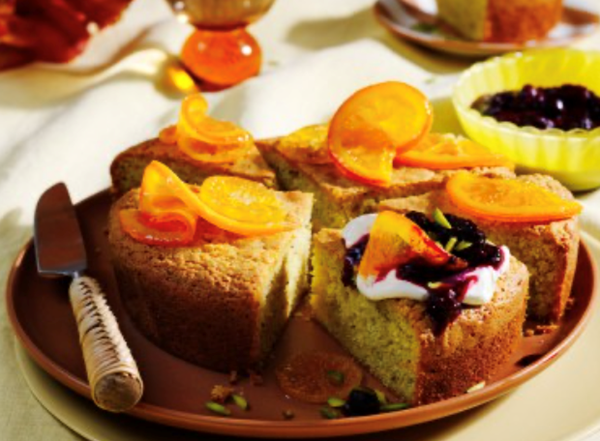 Pistachio olive oil cake with crème fraîche and berry compote