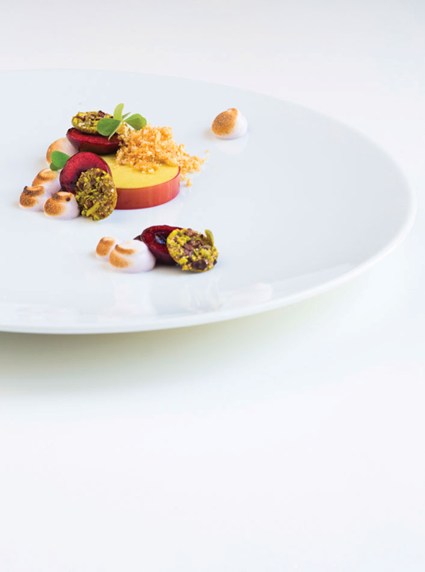 Pistachio parfait with cherry pit crumble, red wine meringue and cocoa nibs