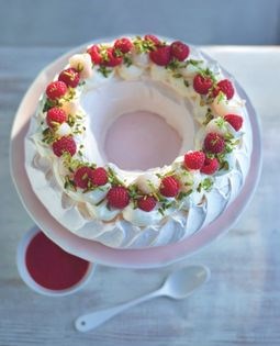 Pistachio Pavlova wreath with raspberries, lychees & lime