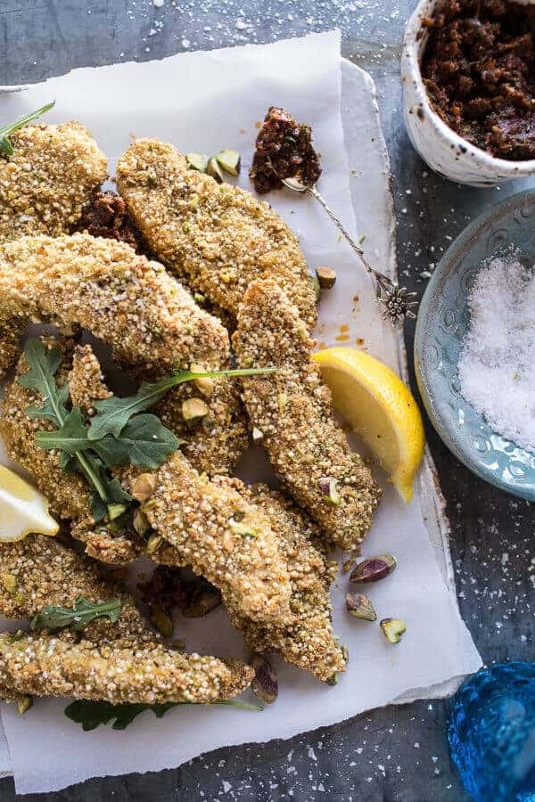 Pistachio quinoa dukkah crusted chicken fingers with sun-dried tomato pesto